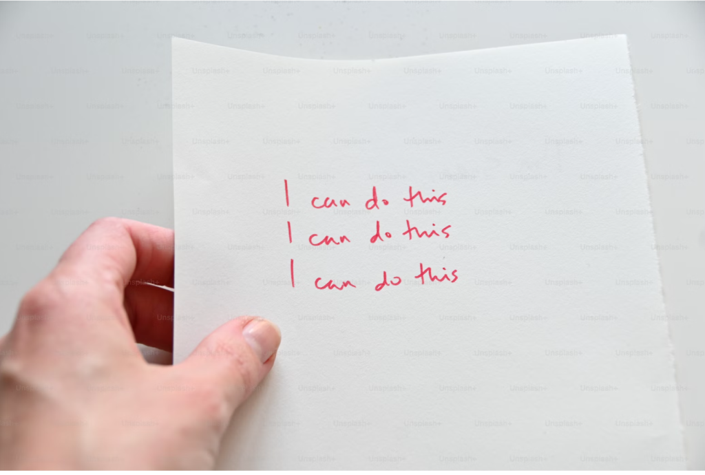 Writing on a page that repeats the phrase, "I can do this."